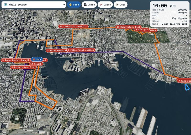 Screenshot: a 3D aerial map of Baltimore with the race route drawn in orange and purple around the harbour